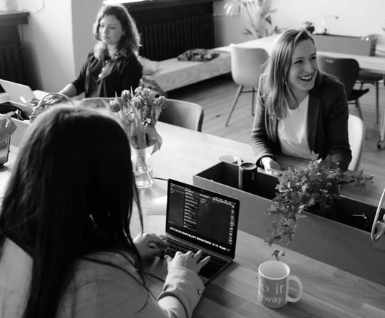 People working with notebooks in an office